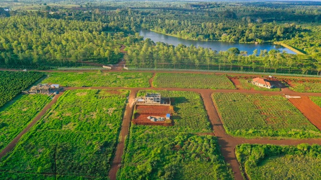 Aerial view of plots with lake in the distance at Oaklands