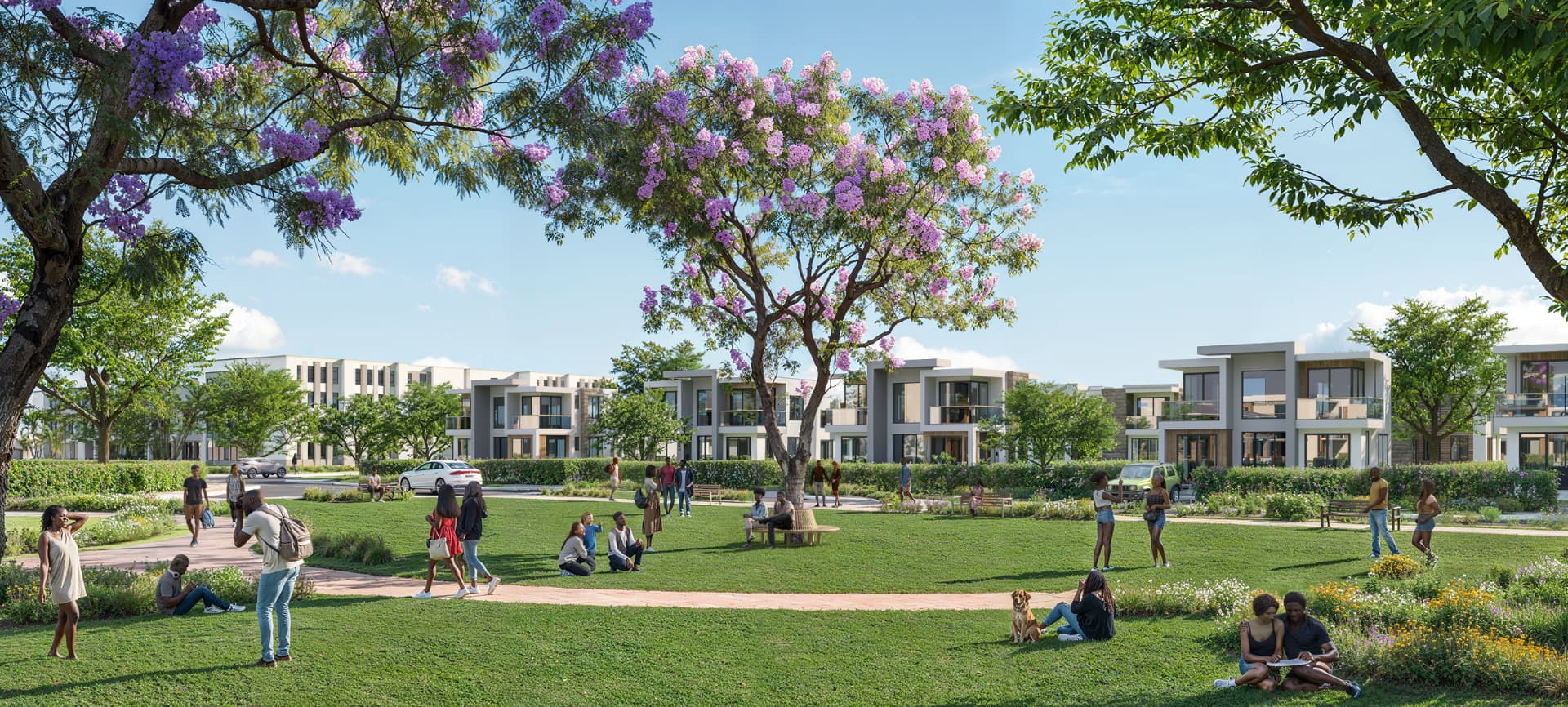 Park with jacaranda trees in front of Ayanna Waters villas