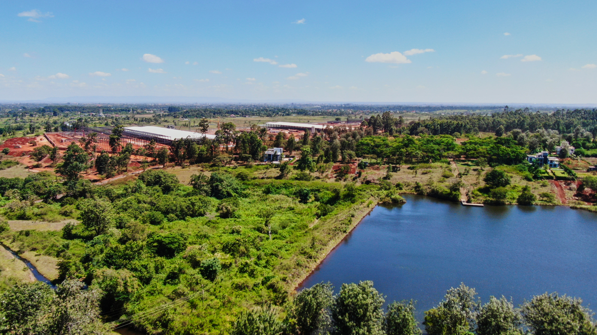 Aerial view of Oaklands lake with industrial buildings beyond
